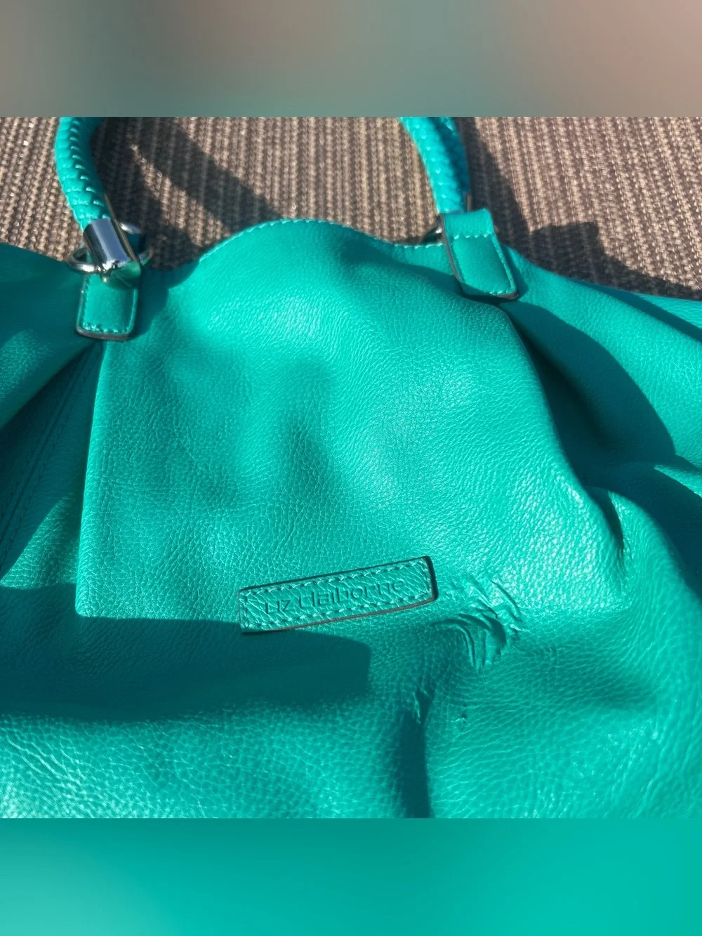Liz Claiborne teal leather handbag with braided handles and tassel